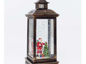 Djeda mraz u fenjeru sa letecim pahuljama