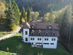 AURA / Commercial property with thermal water next to the river
