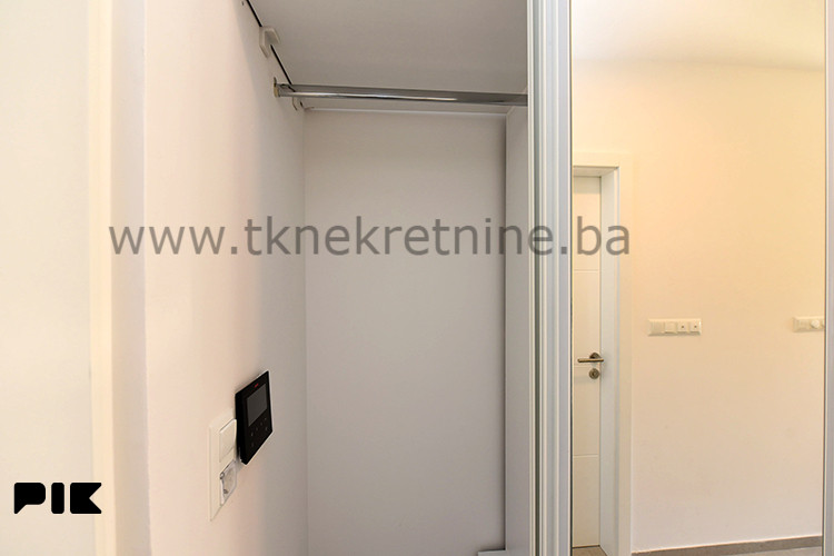 NOVOGRADNJA - Dizajnerski uređena garsonjera 26 m2, sa parkingom 15